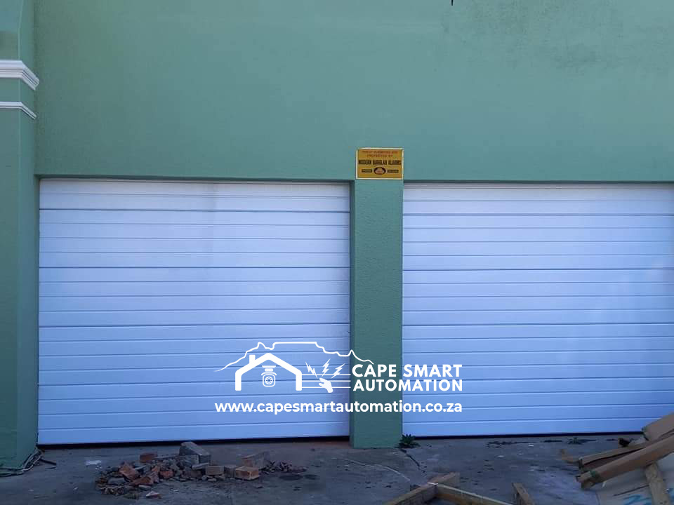 White automated garage doors at a residential property