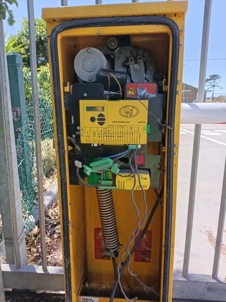 Open Centurion SECTOR boom-gate cabinet showing the controller, wiring and drive mechanism.
